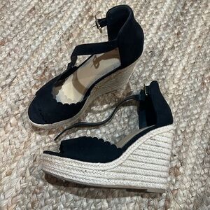 Black scalloped wedge heels